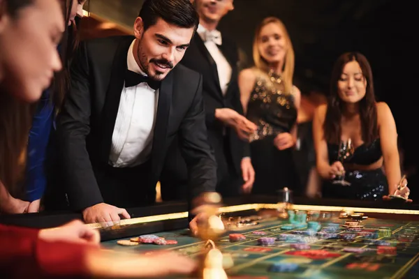 A person using their device against a moody casino-themed background, illustrating the smooth re-entry process at JEETA.
